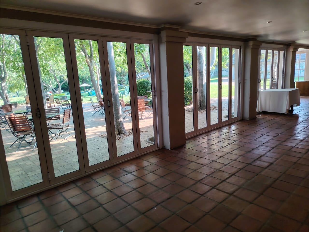 Clean tiled venue floor and folding glass doors