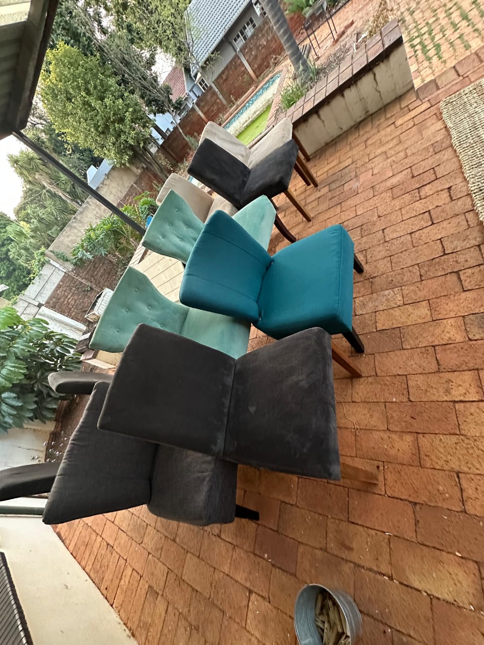 Upholstered dining chairs drying outdoors