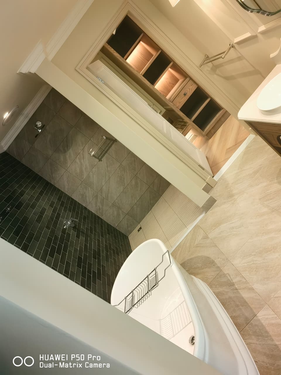 Tiled bathroom with a walk-in shower and a freestanding bath