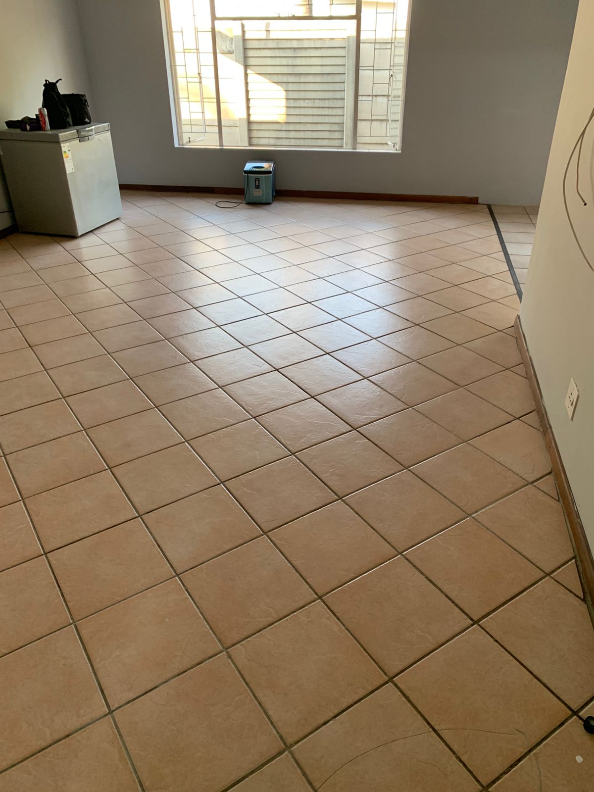 Clean tiled floor in an empty room