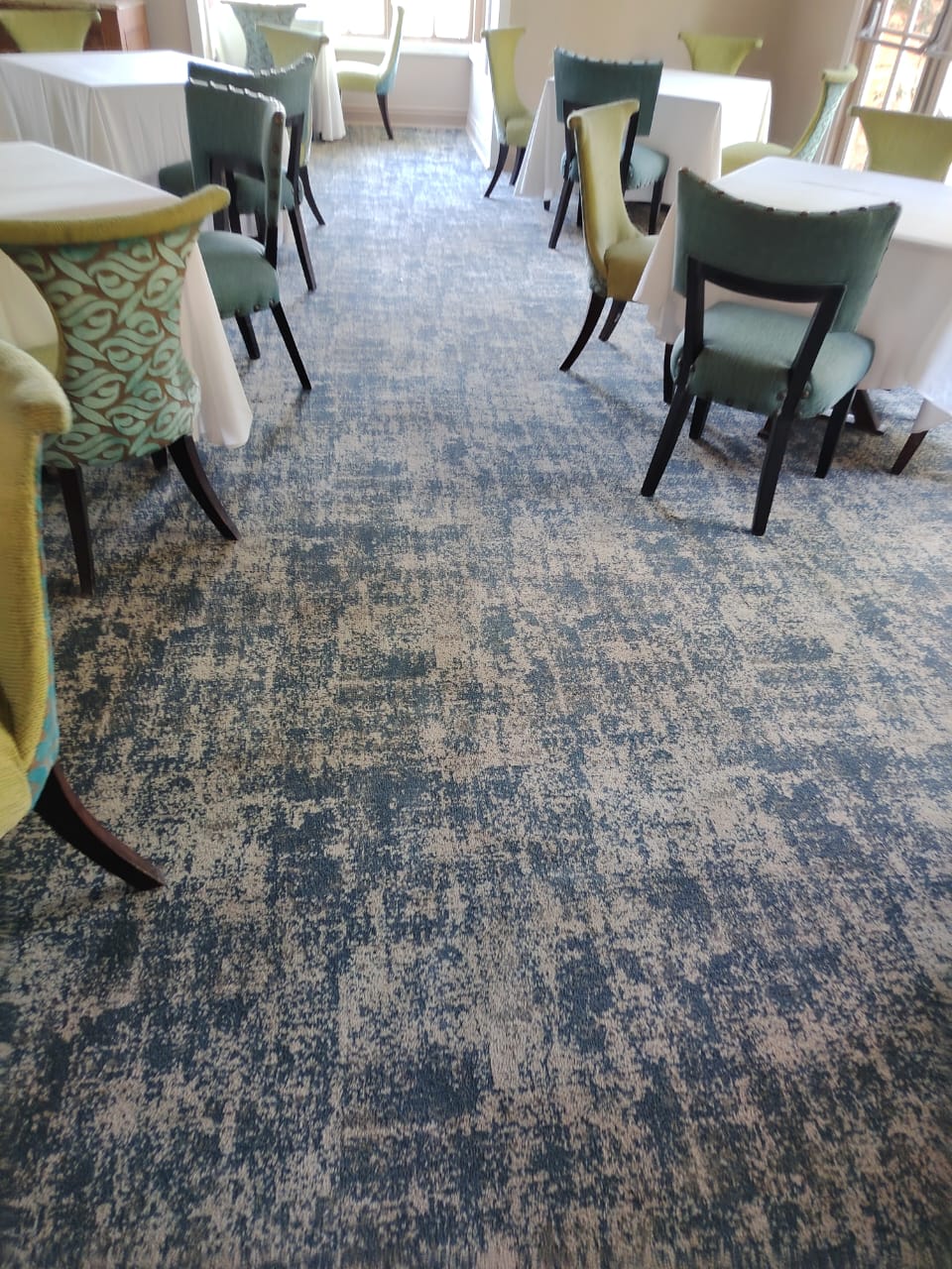 Clean patterned carpet in a restaurant dining room