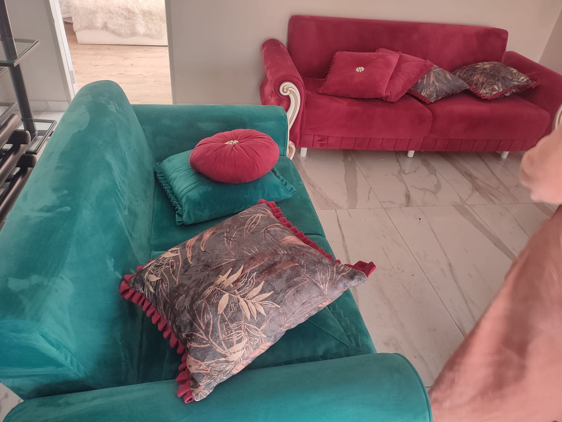 Green and red velvet sofas