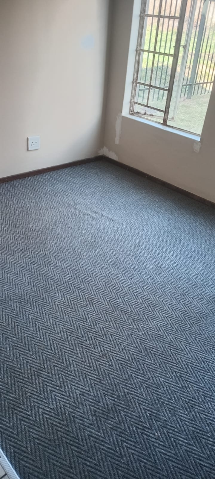 Clean grey herringbone carpet