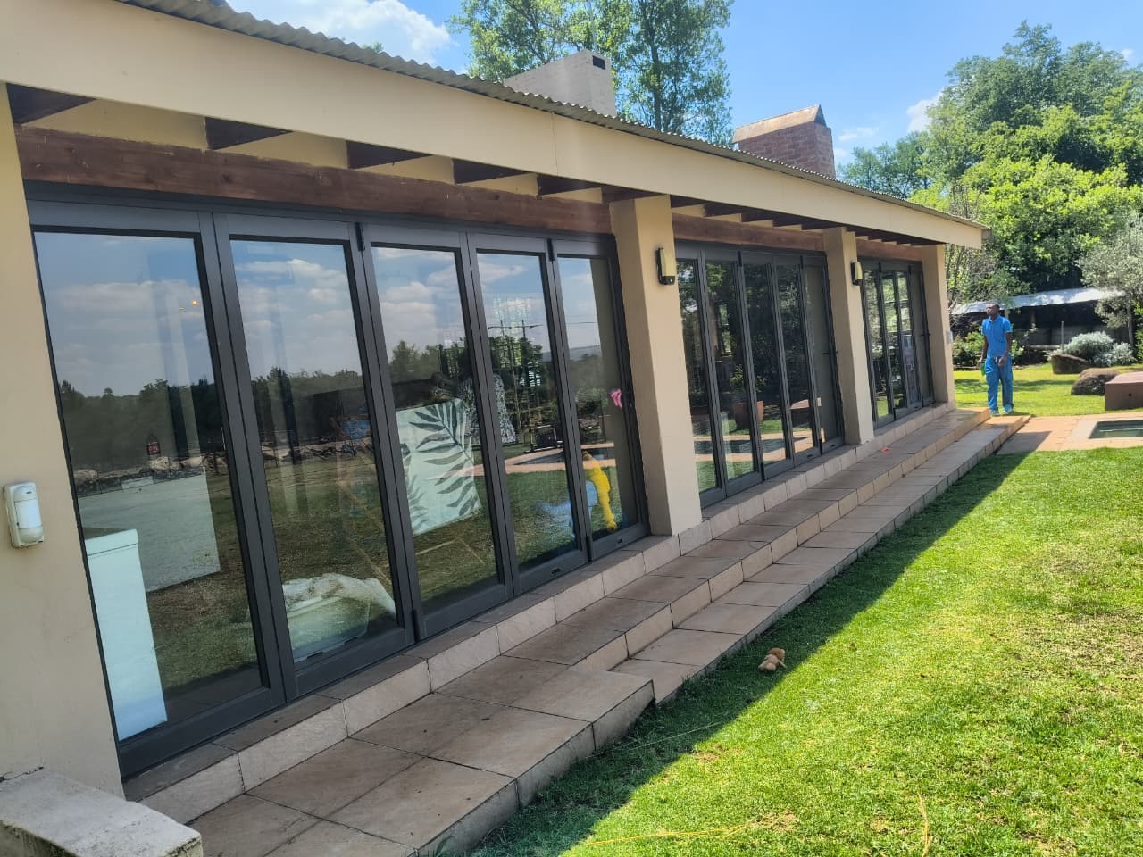 Clean folding glass doors on a house exterior