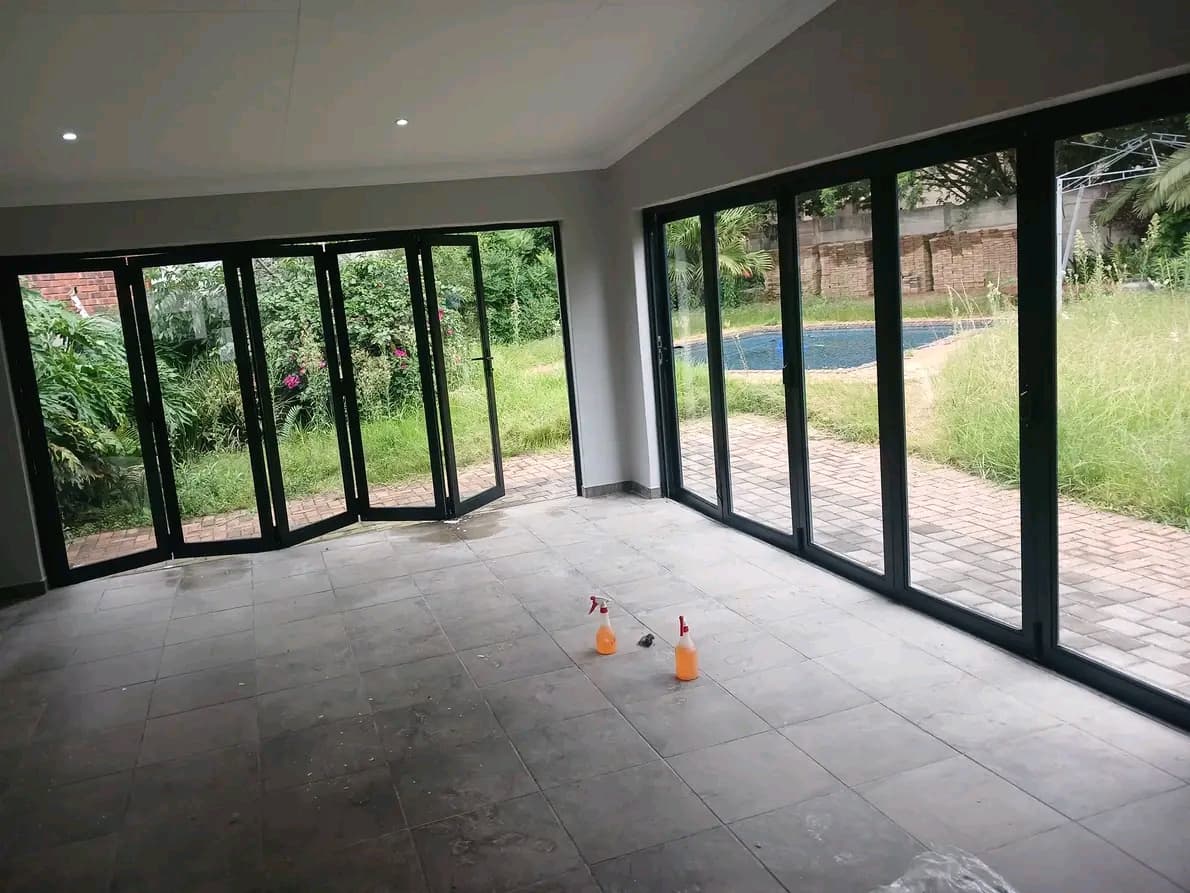 Empty sunroom with folding glass doors after cleaning