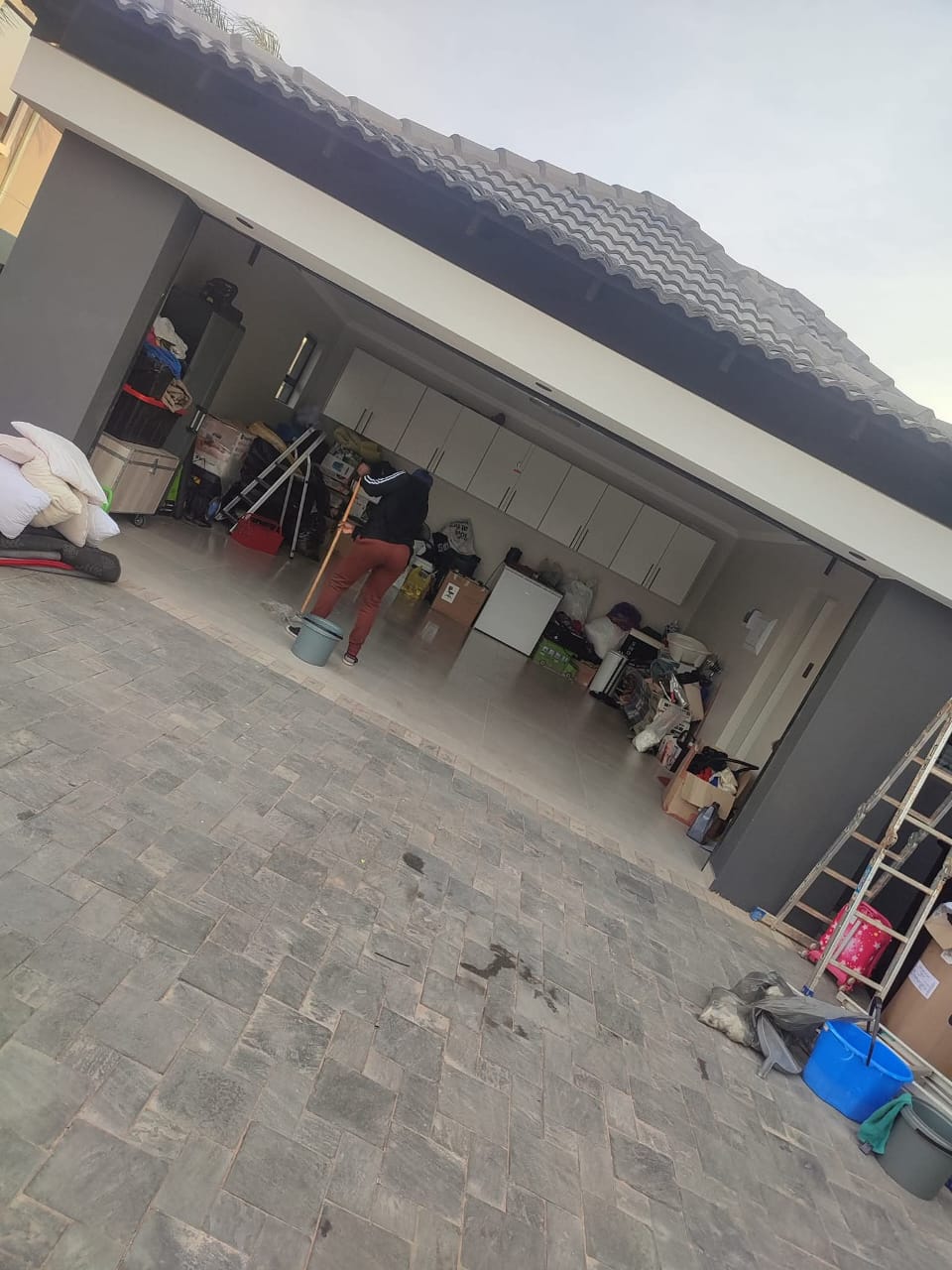 Cleaner mopping a garage floor