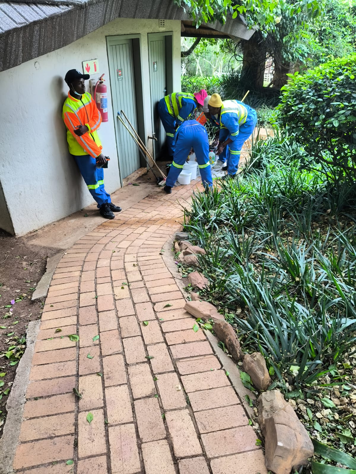 Team cleaning an outdoor ablution block