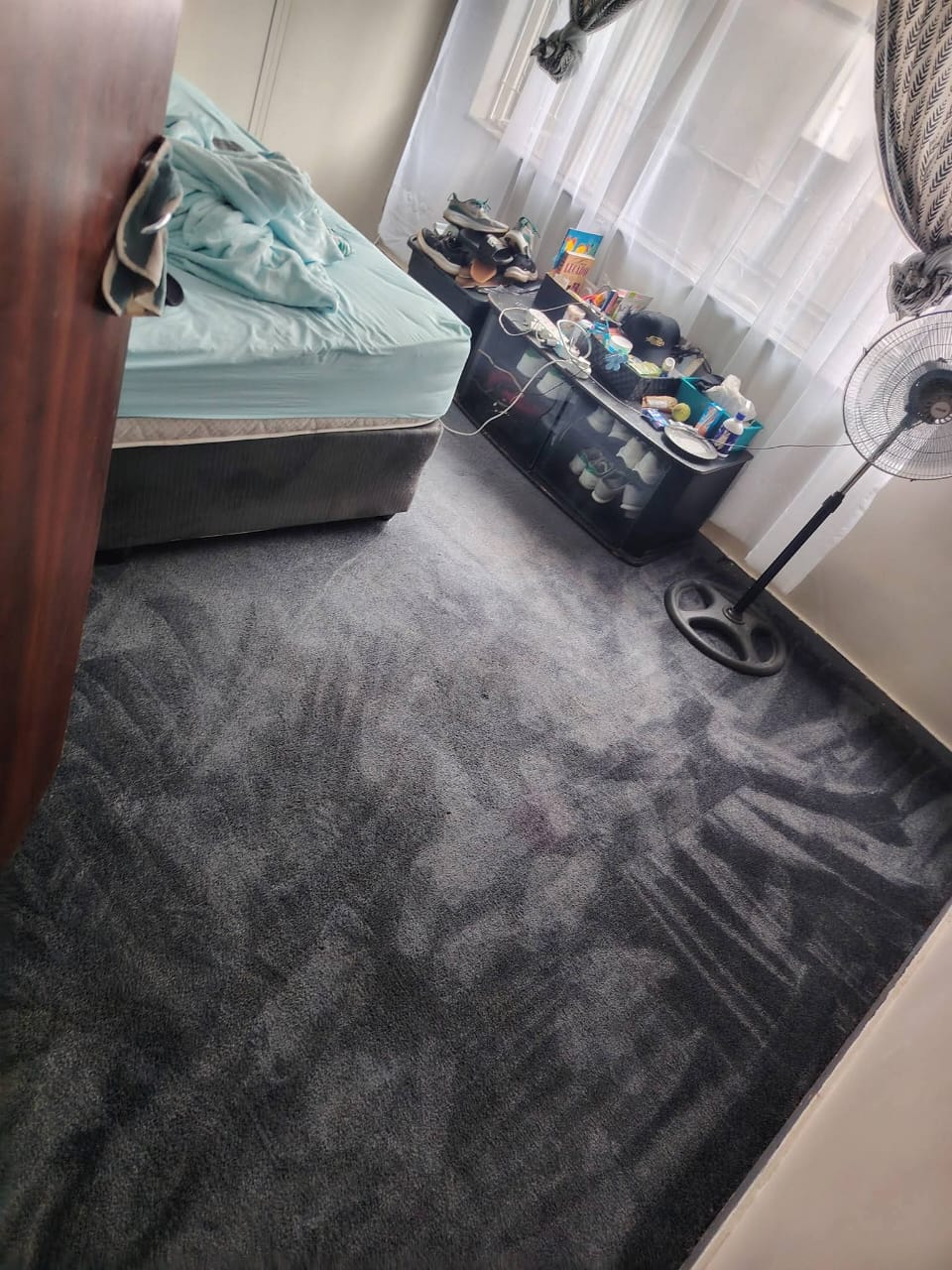 Grey bedroom carpet showing cleaning passes